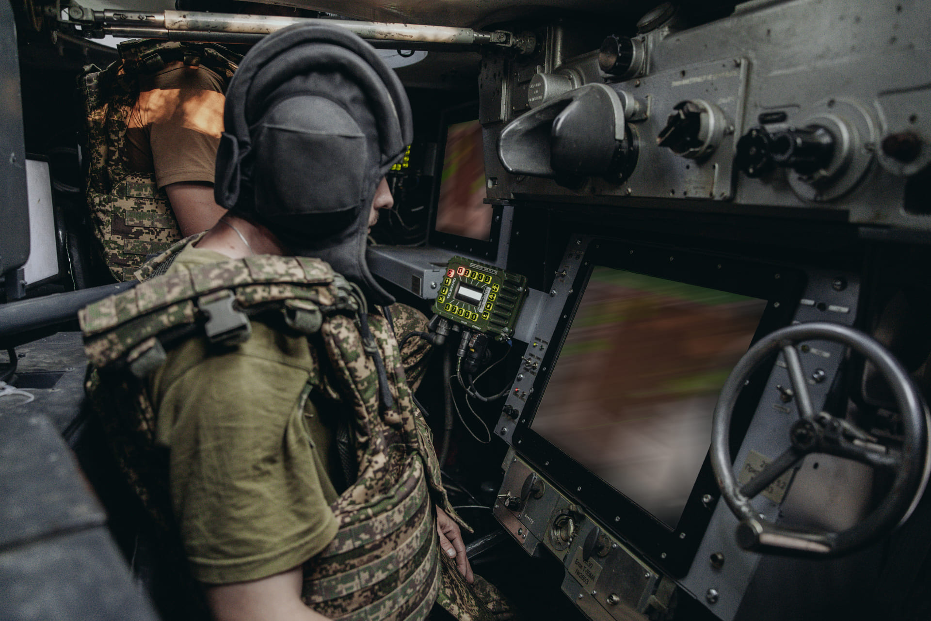 Crew of the Strazh Anti-Aircraft Missile and Artillery Battalion inside the combat compartment of a self-propelled anti-aircraft system