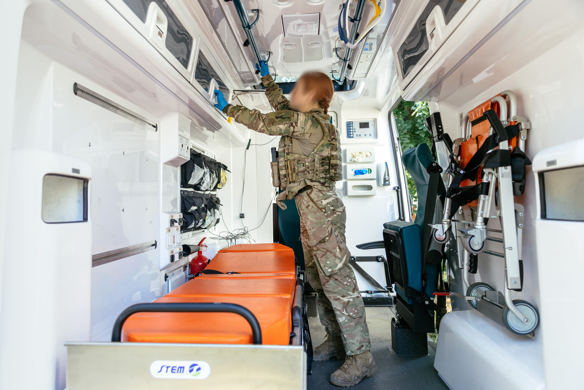 Combat medic of the Strazh Anti-Aircraft Missile and Artillery Battalion inside an armored ambulance